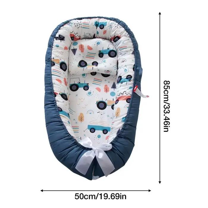 Lit nid de bébé avec oreiller